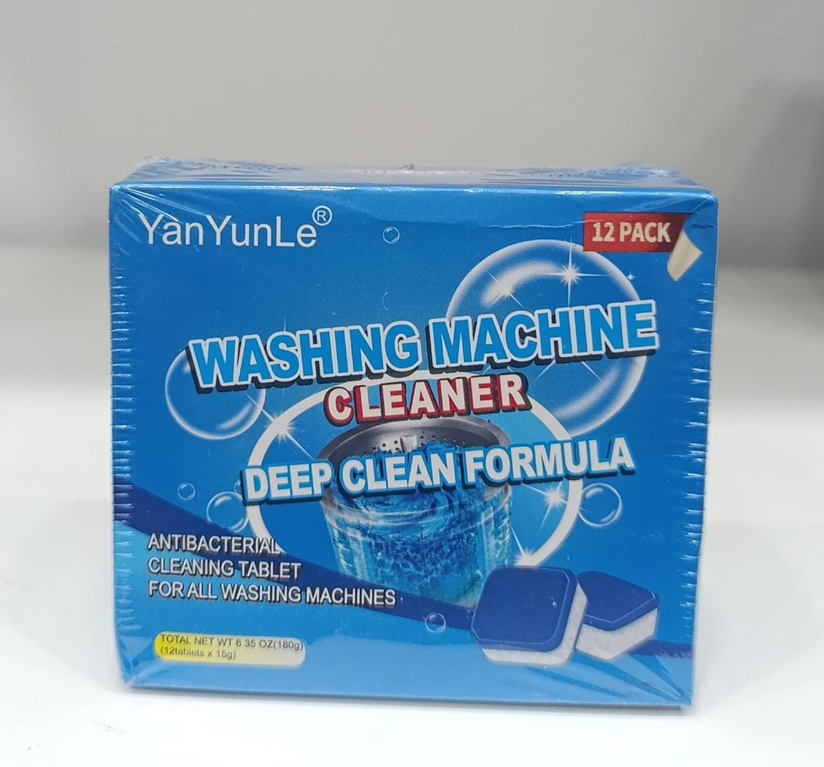 Box of YanYunLe washing machine cleaner with blue and white design on a gray background