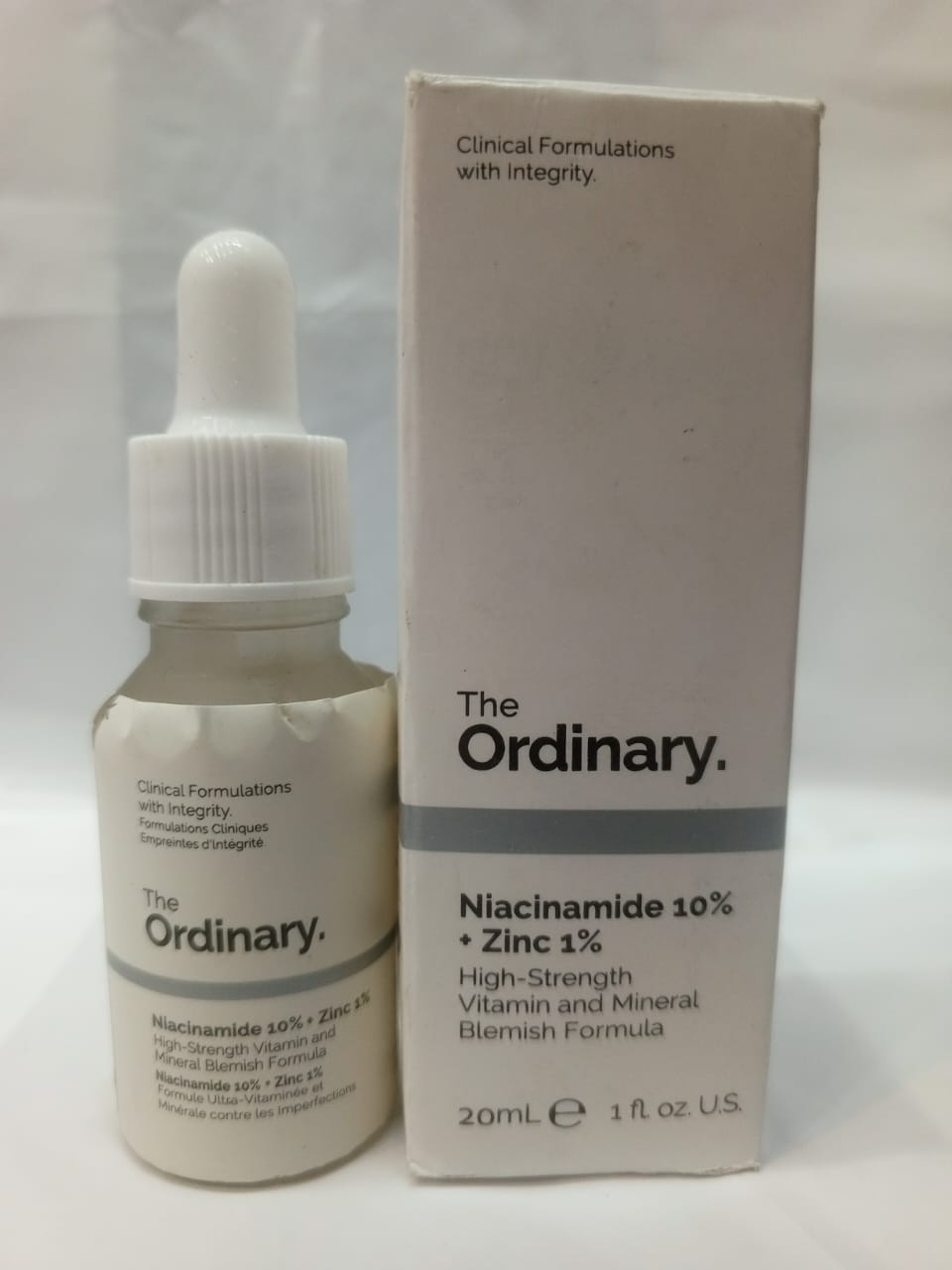 The Ordinary skincare serum bottle and packaging on a white background