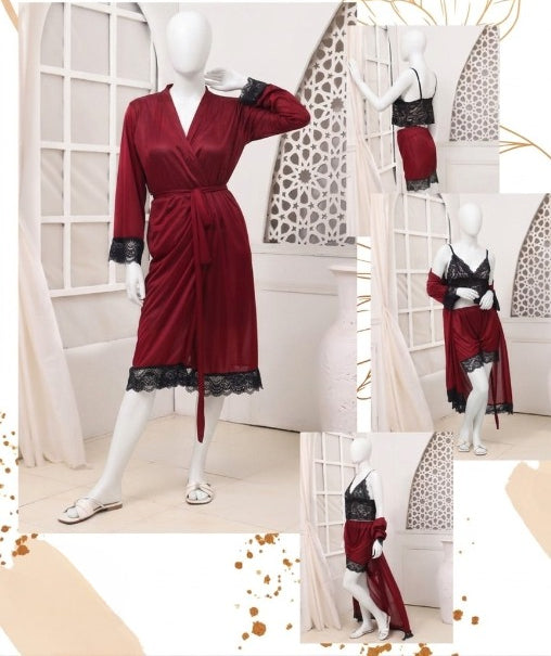 Red dress with black lace trim on a mannequin against a white curtain background.