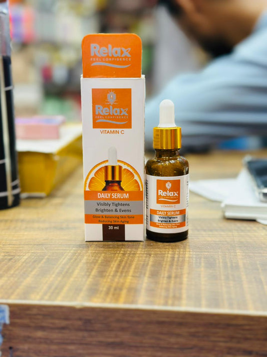 Relax Daily Serum bottle and packaging on a wooden surface