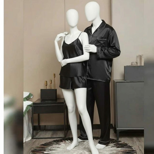 Black satin pajama set on mannequins against a neutral background