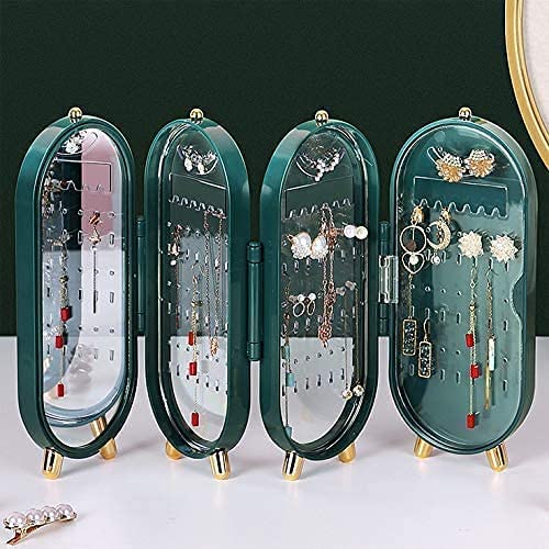 Set of four green jewelry organizers with earrings on a white surface.