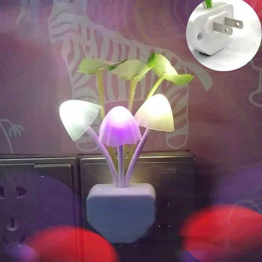 Mushroom-shaped LED night light with a plug on a colorful background