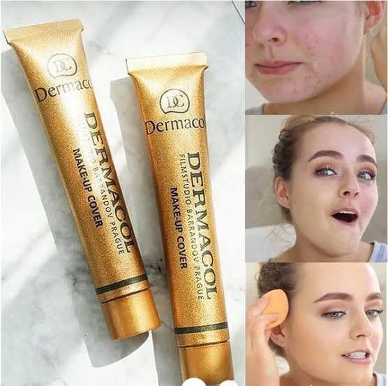 Two gold tubes of Dermacol makeup cover on a marble surface with before and after effects shown.