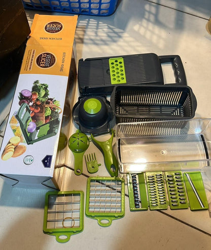 Vegetable chopper set with attachments and packaging on a table