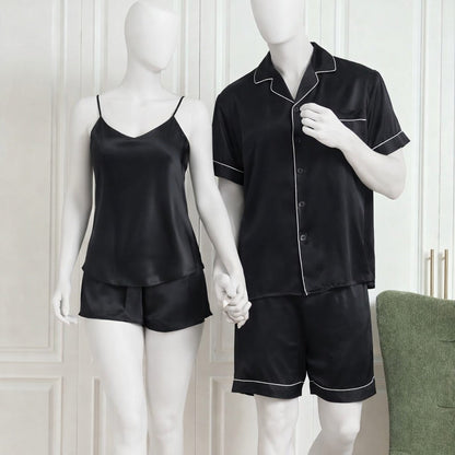 Black satin pajama set on mannequins against a white background