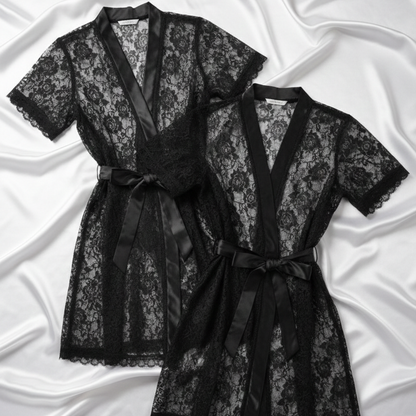 Black lace robe with satin trim on a white satin background