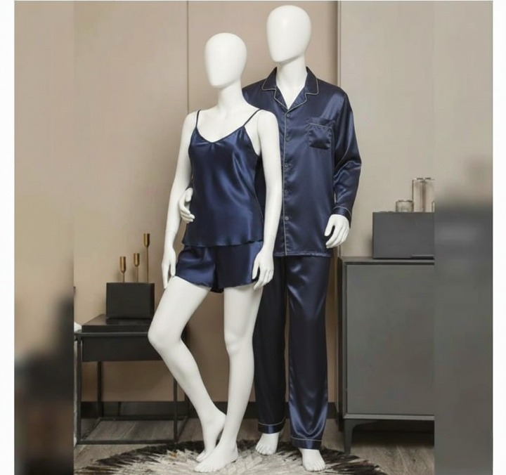 Navy satin pajama set on mannequins against a neutral background