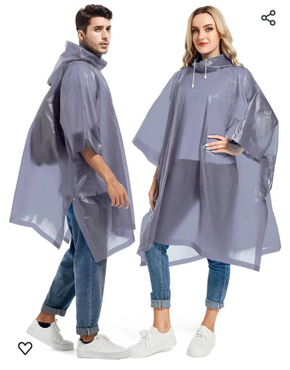 Two people wearing gray rain ponchos on a white background